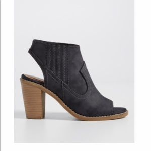 Blythe Faux Leather heeled bootie with peep toe.